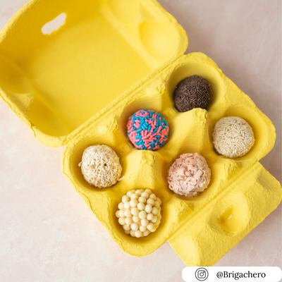 6-cell yellow pulp egg carton filled with desserts