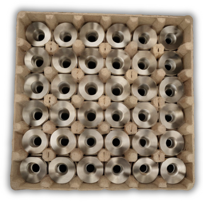 Natural paper pulp tray with 36 cells filled with small machined parts